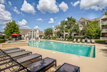 Resort-style swimming pool with sundeck